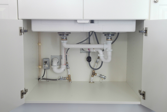 Open cabinet doors to let warm air circulate around plumbing to prevent freezing.